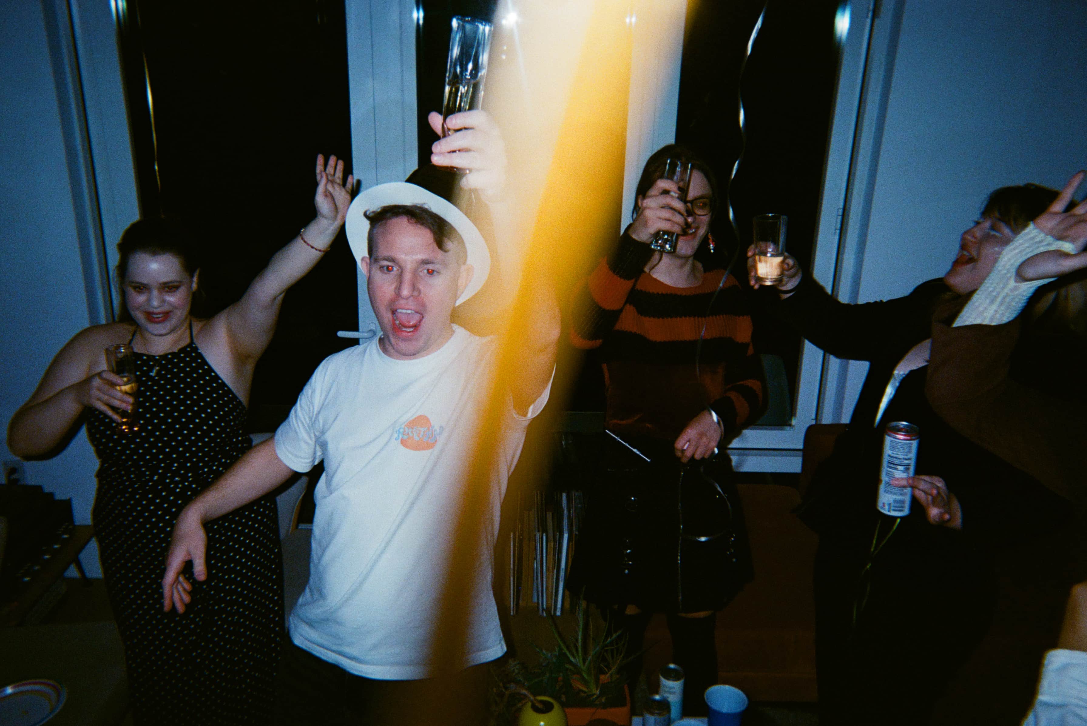 A group of people holding glasses.