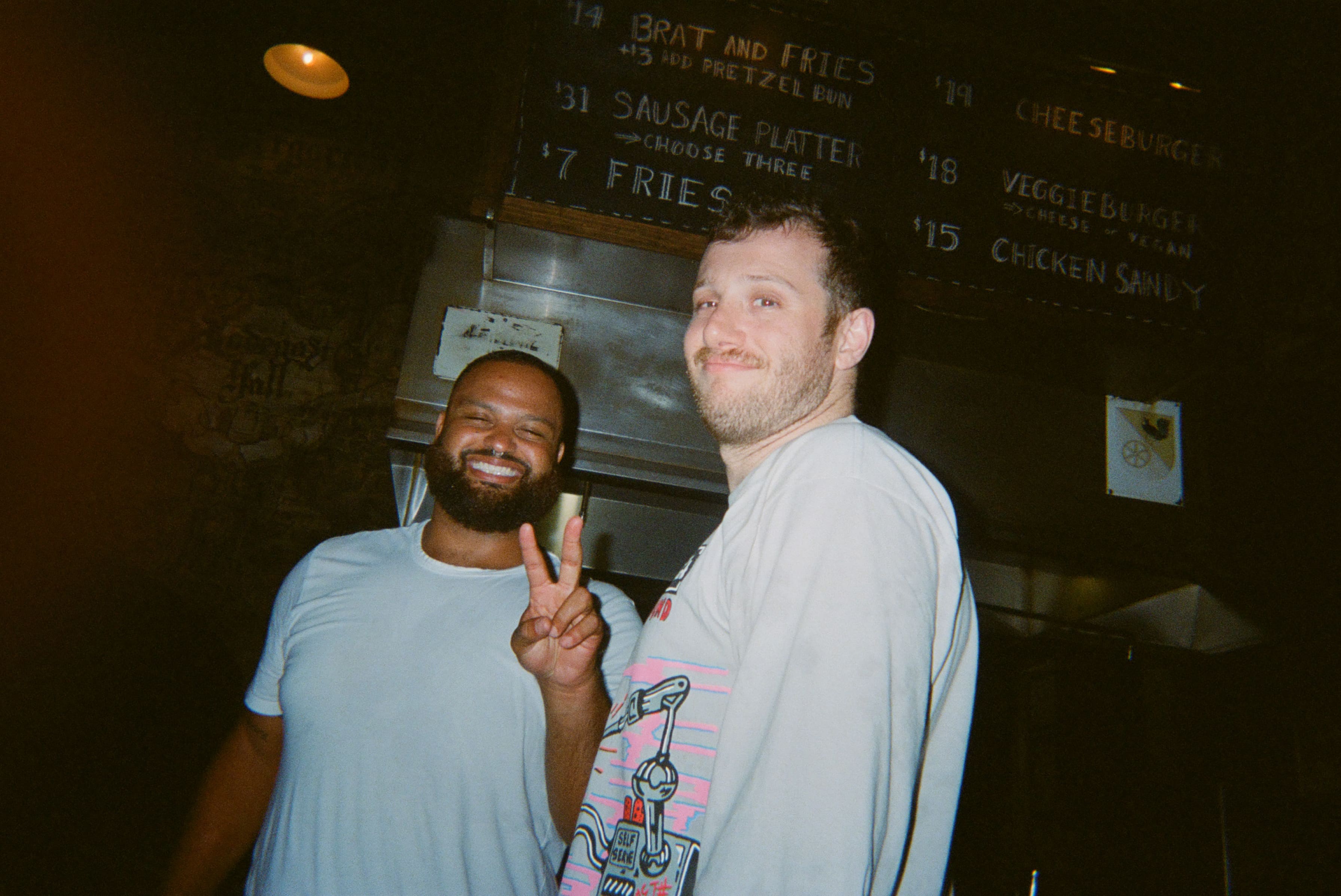 Two men posing for a picture.