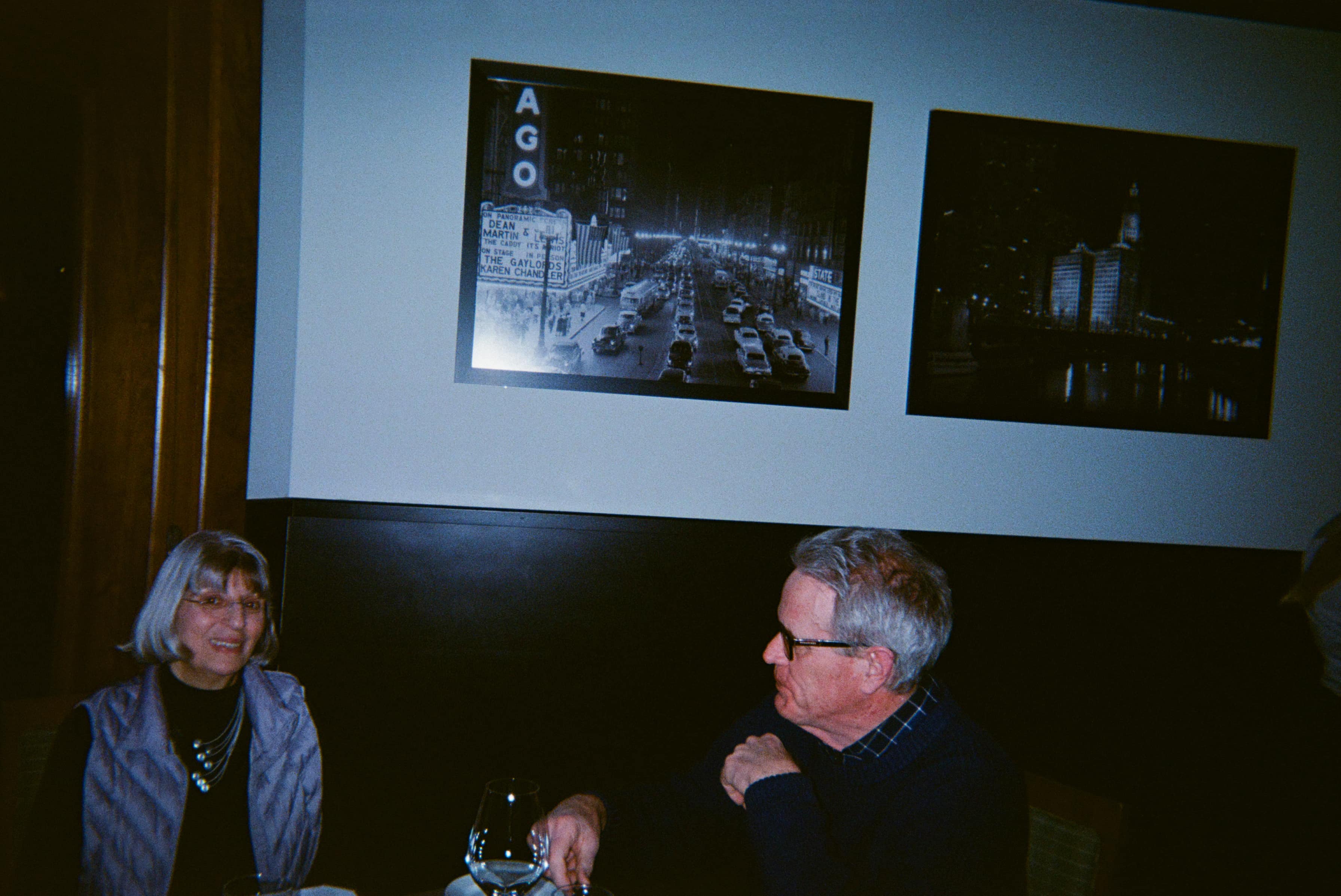 Two people sitting at a table in a restaurant.