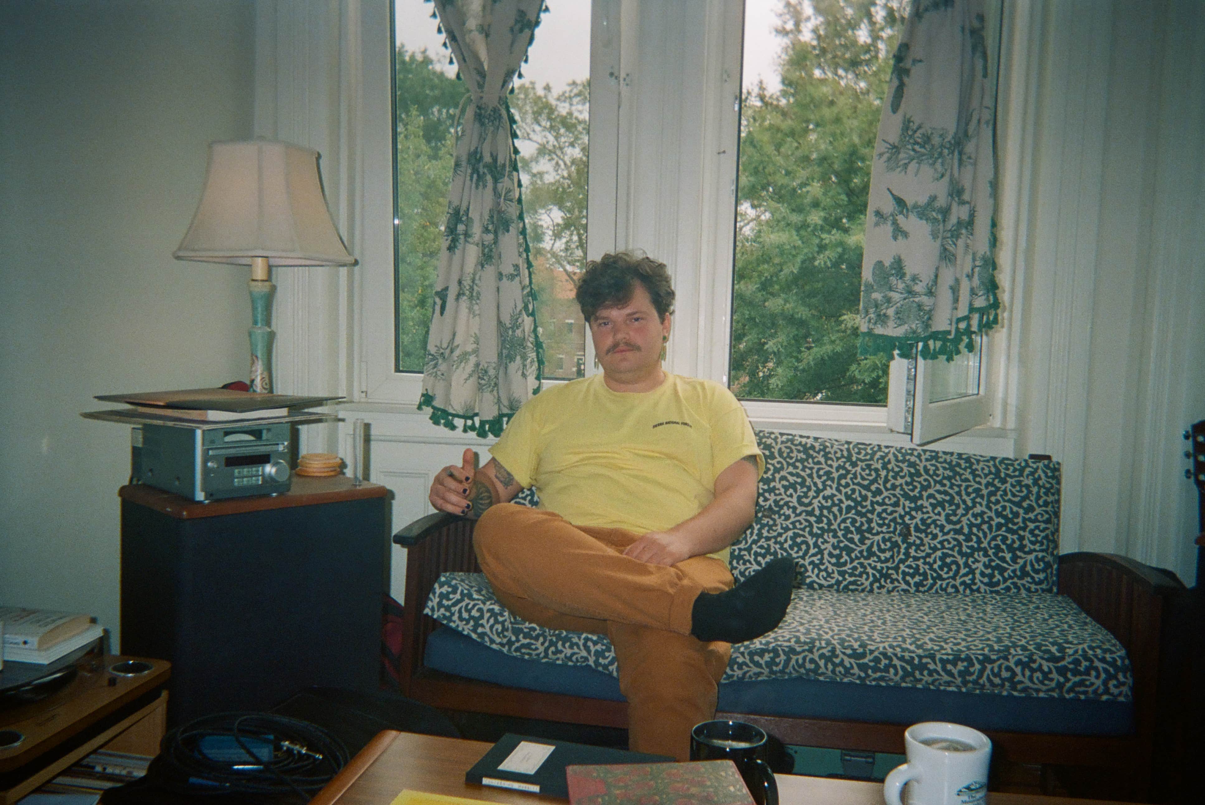 A person sitting on a couch.