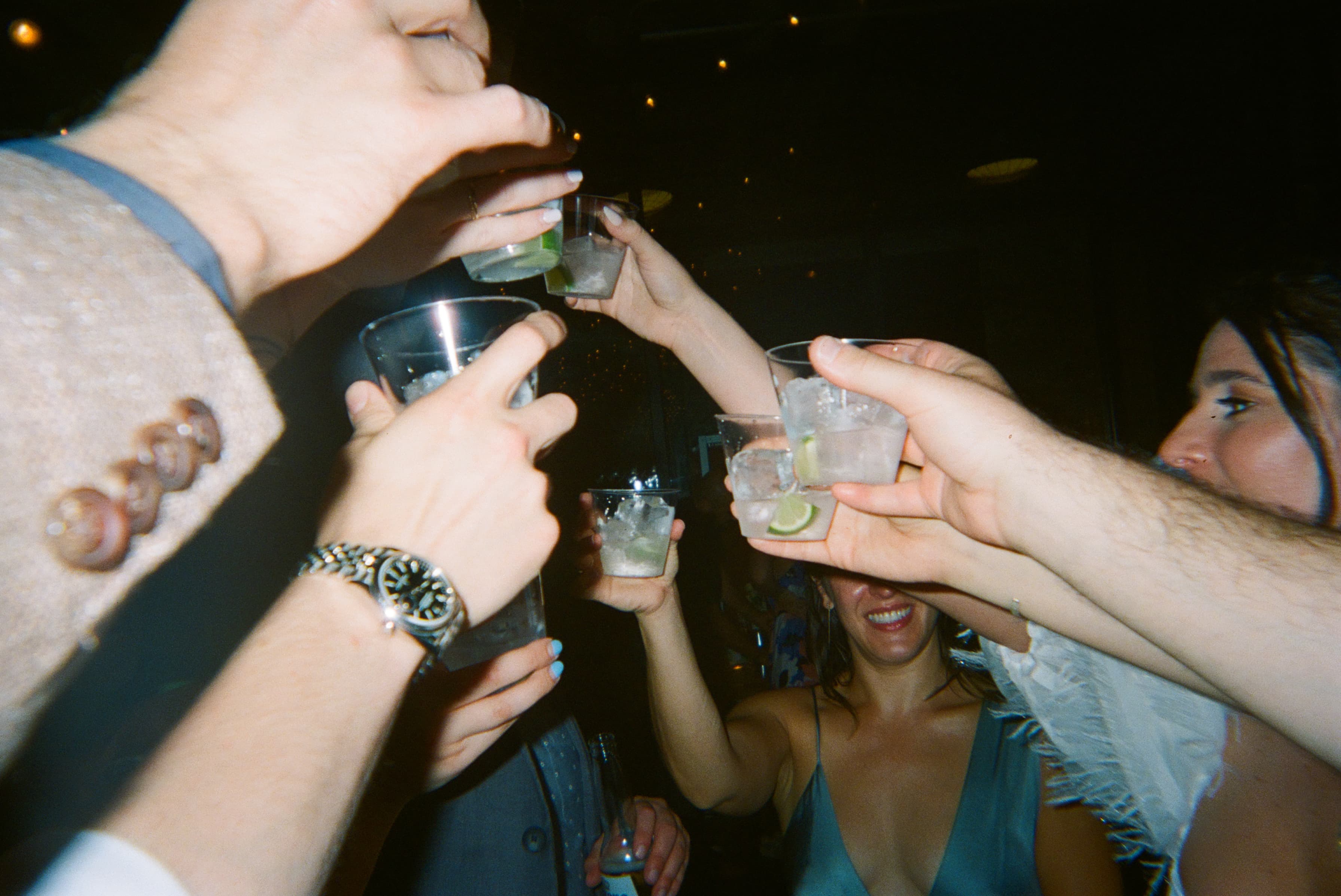 A group of people holding drinks.