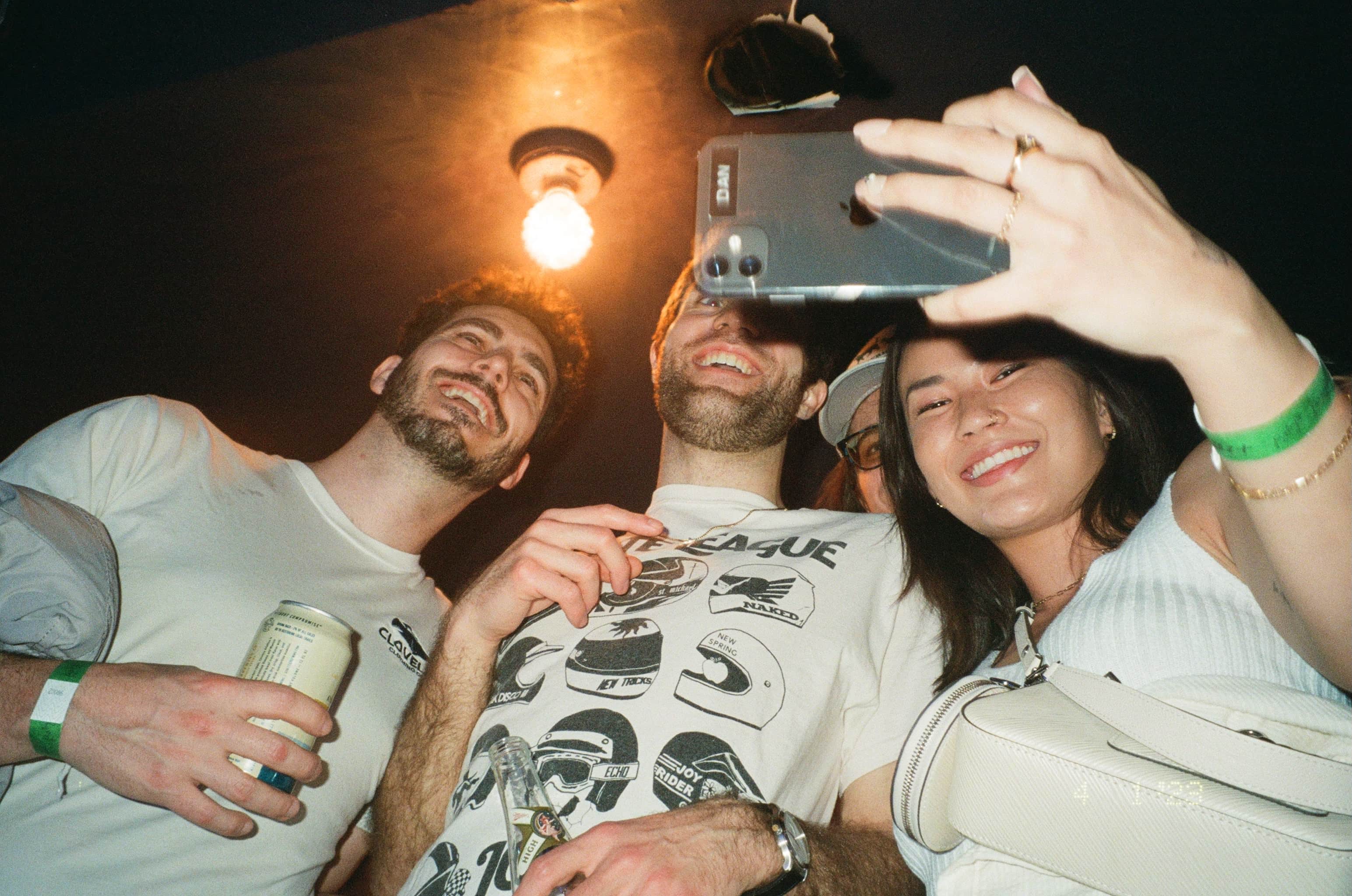 A group of people taking a selfie.