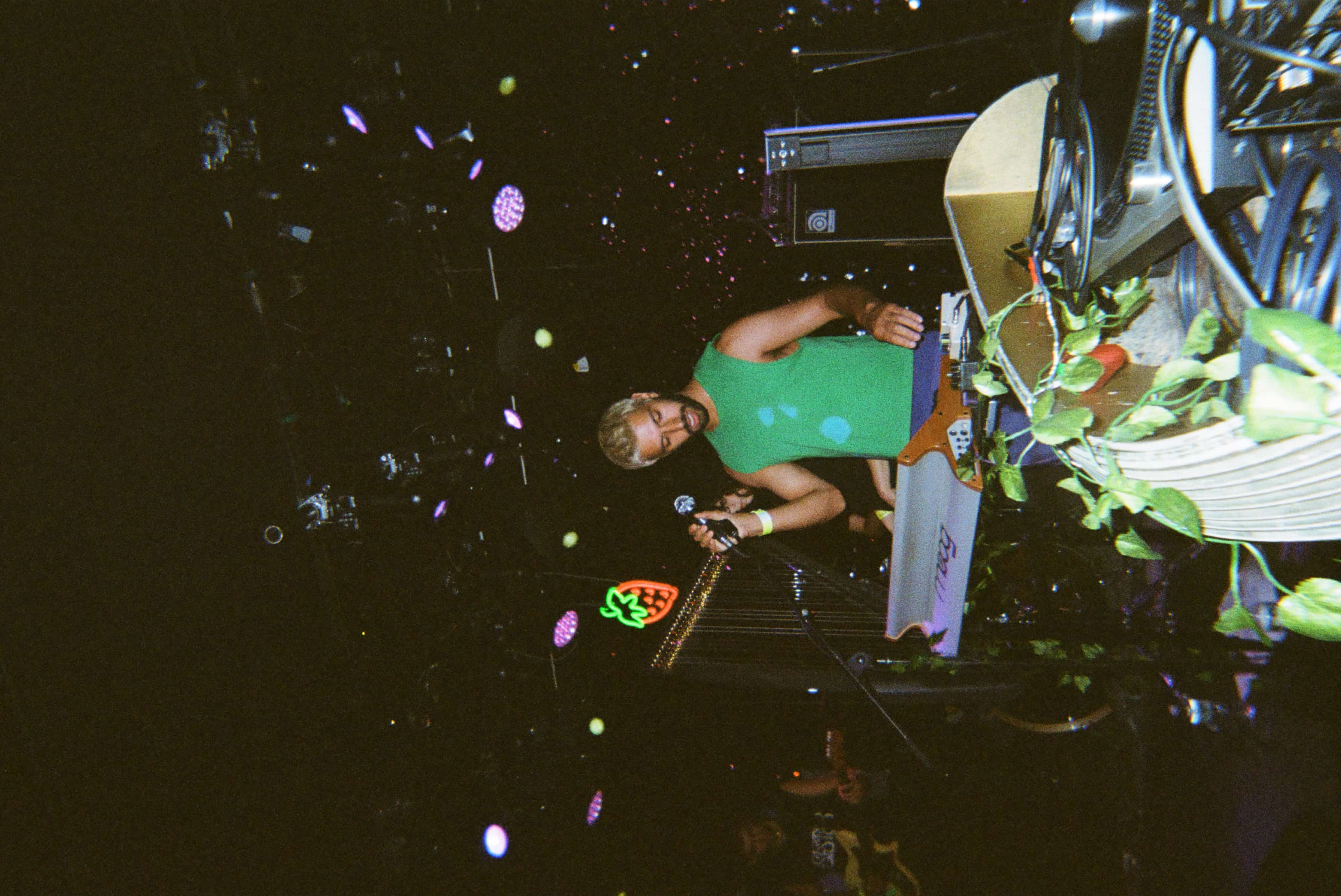 A person playing a piano and singing.