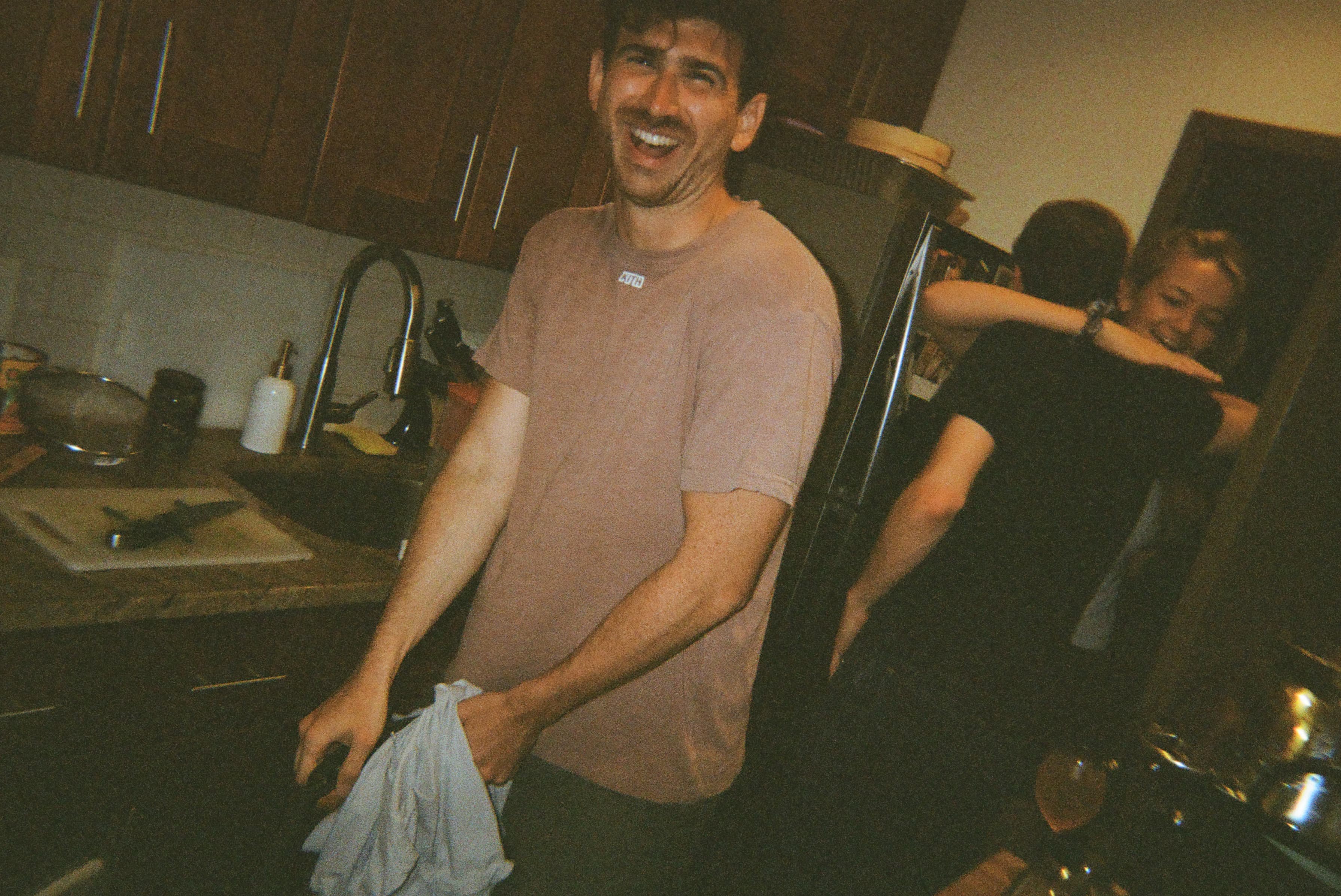 A person standing in a kitchen.