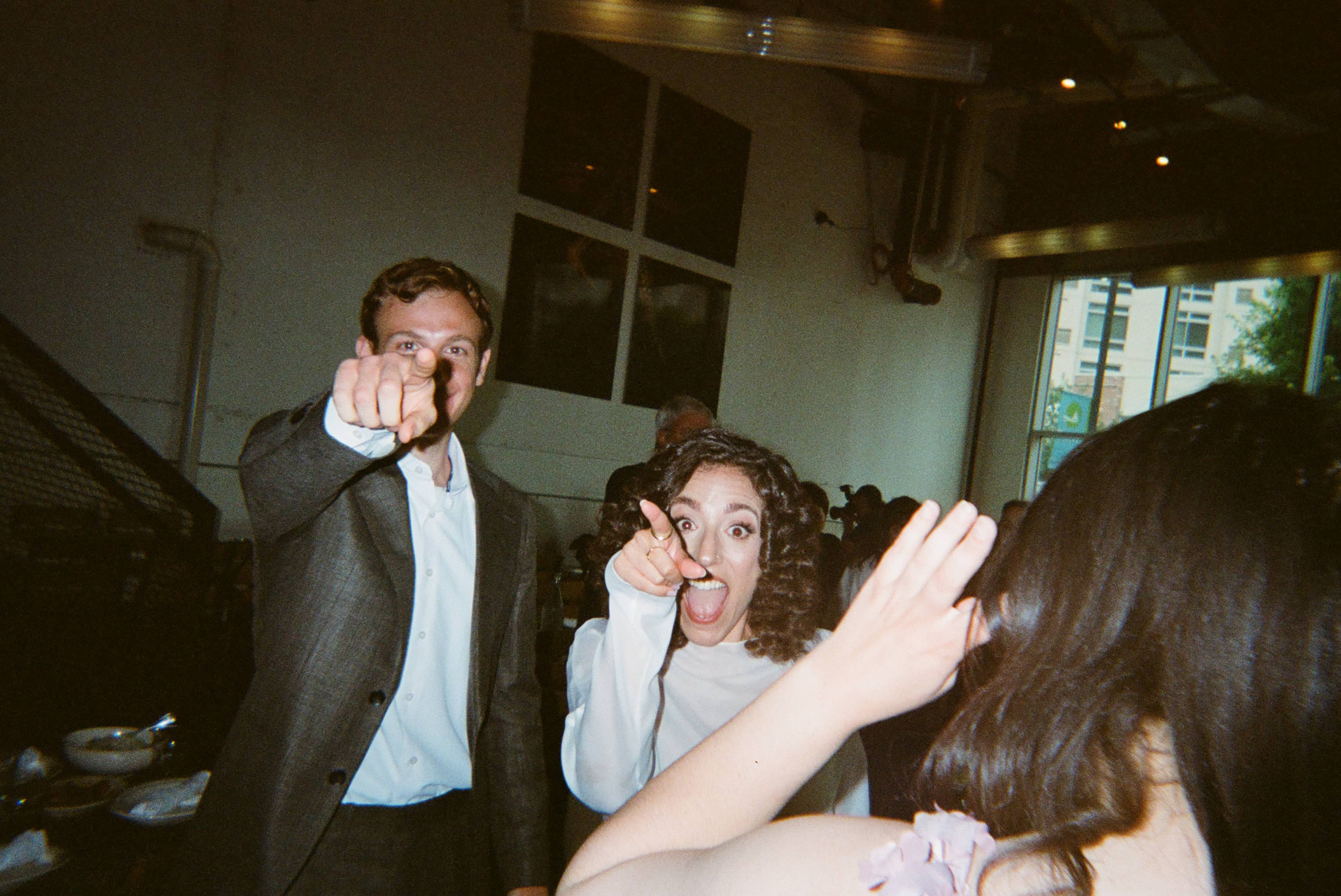 A person pointing at the cameraman.