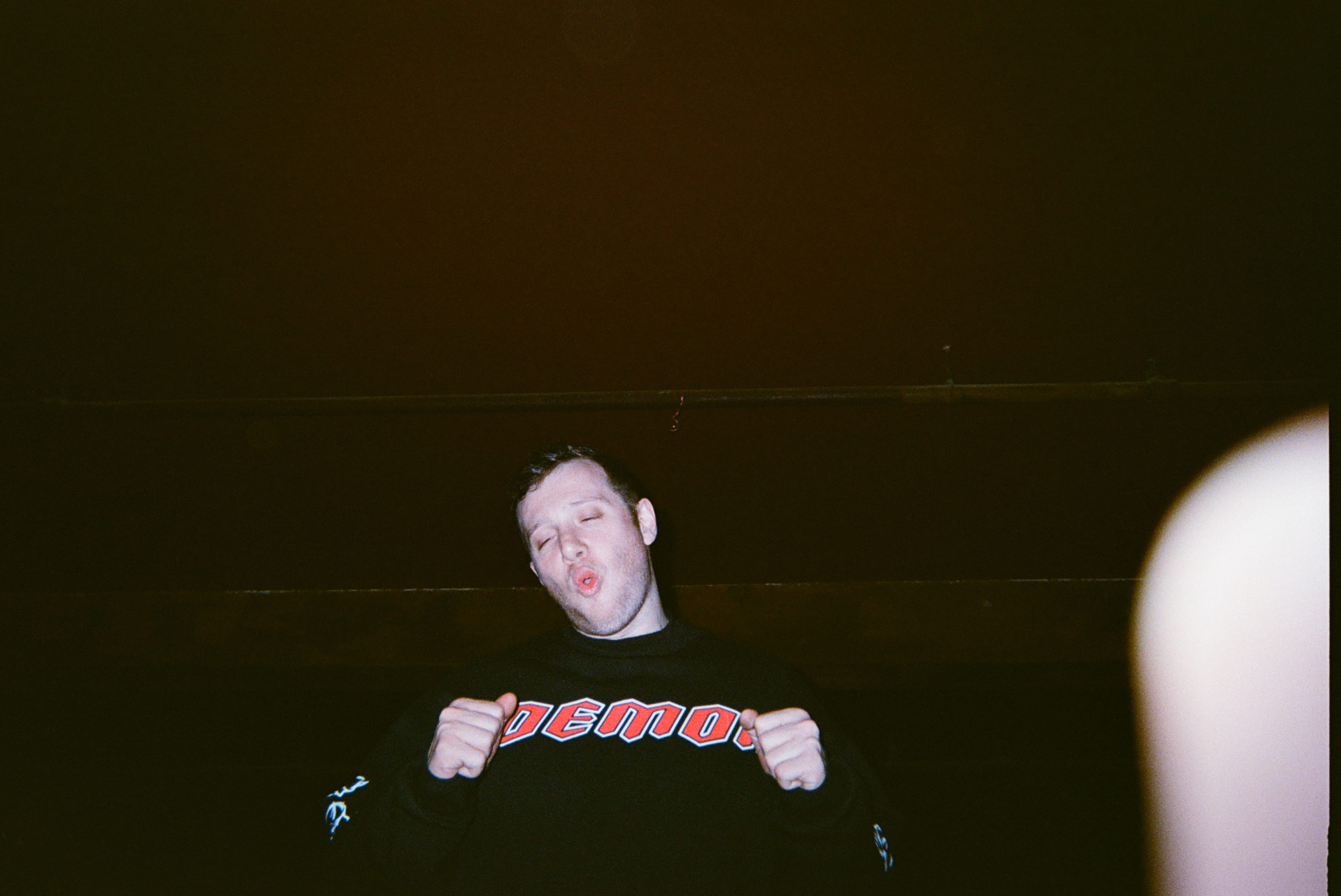 A person making a face with his eyes closed.