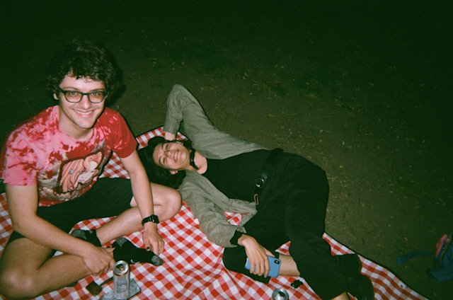 Noah and Camille on a checkered blanket in Tompkins Square Park.