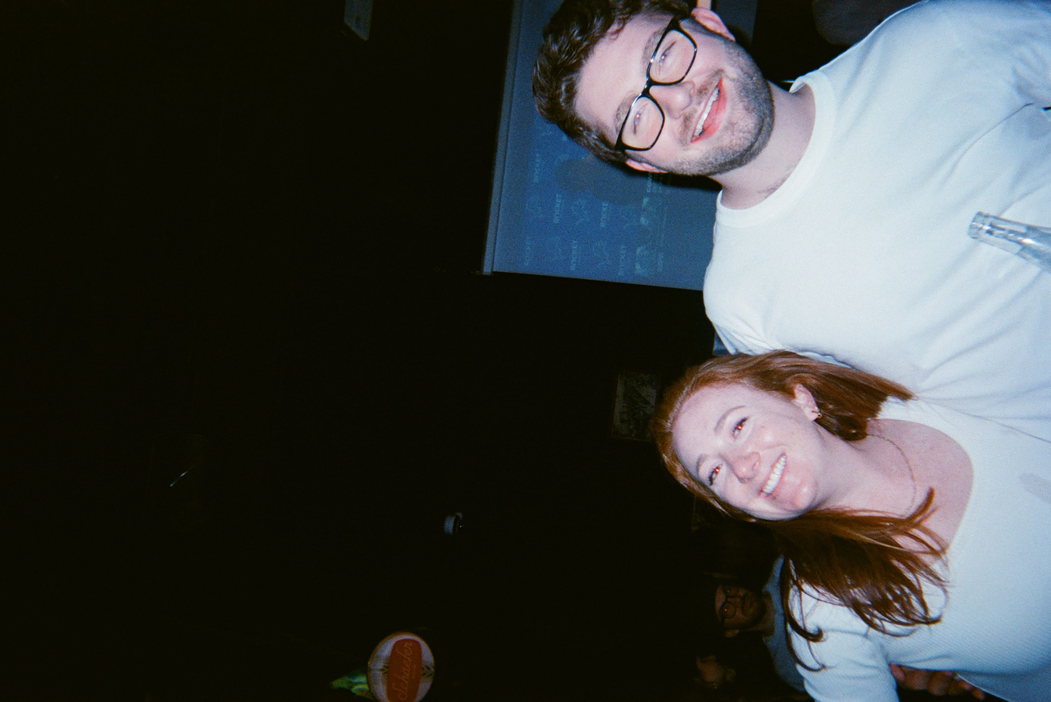 Two people smiling at the camera.