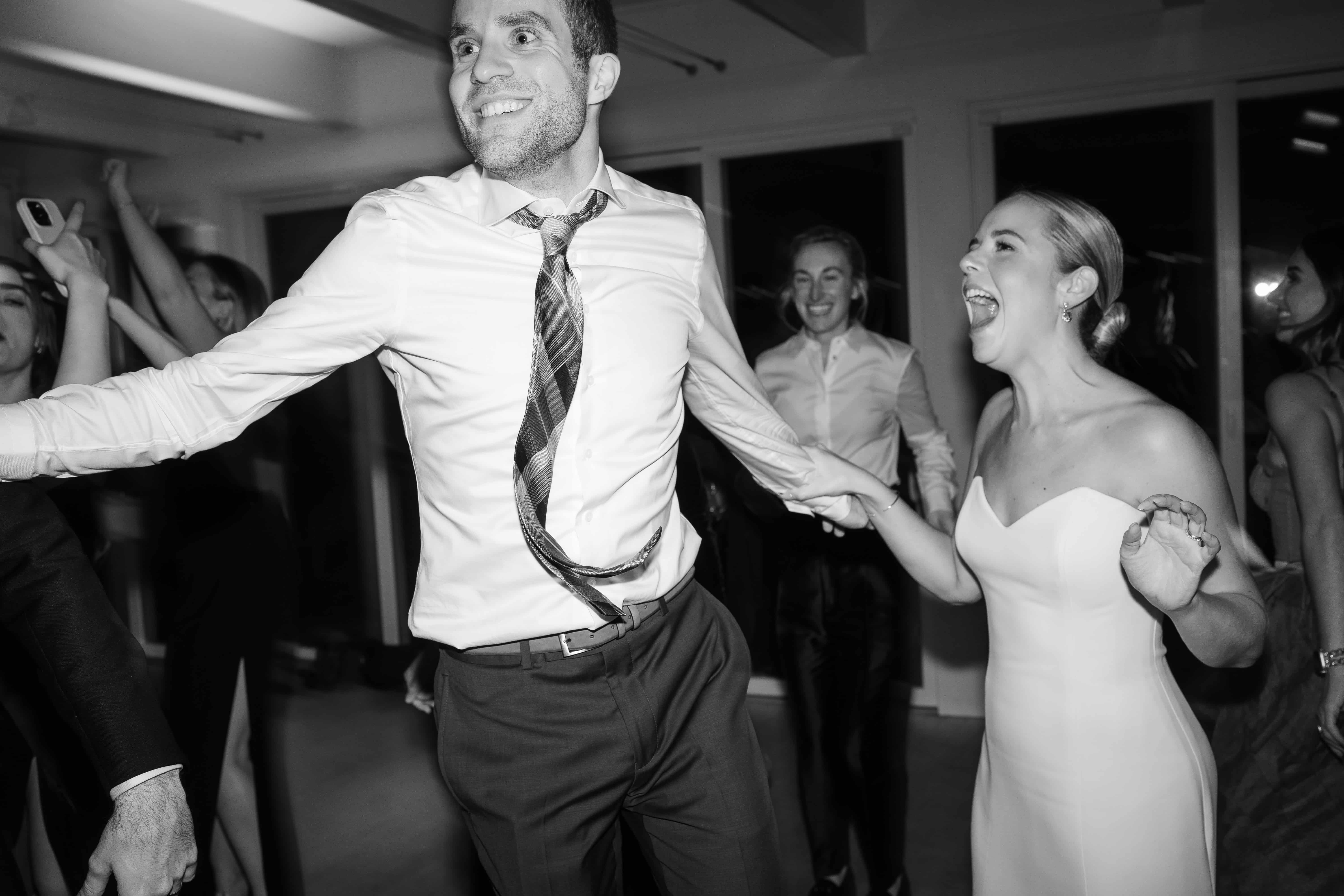 Two people dancing at a wedding.
