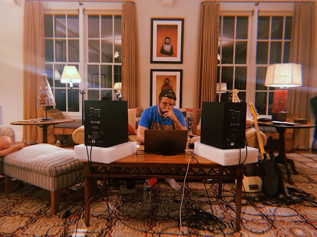 Dan sitting working at a desk behind a laptop.