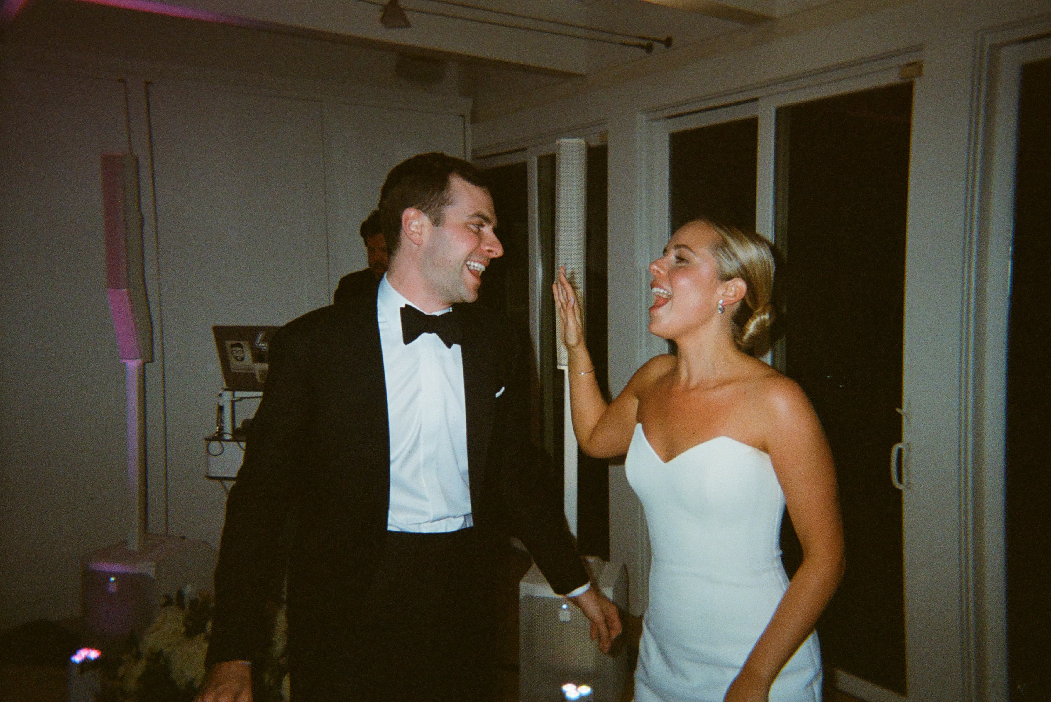 A bride and groom dancing at their wedding.