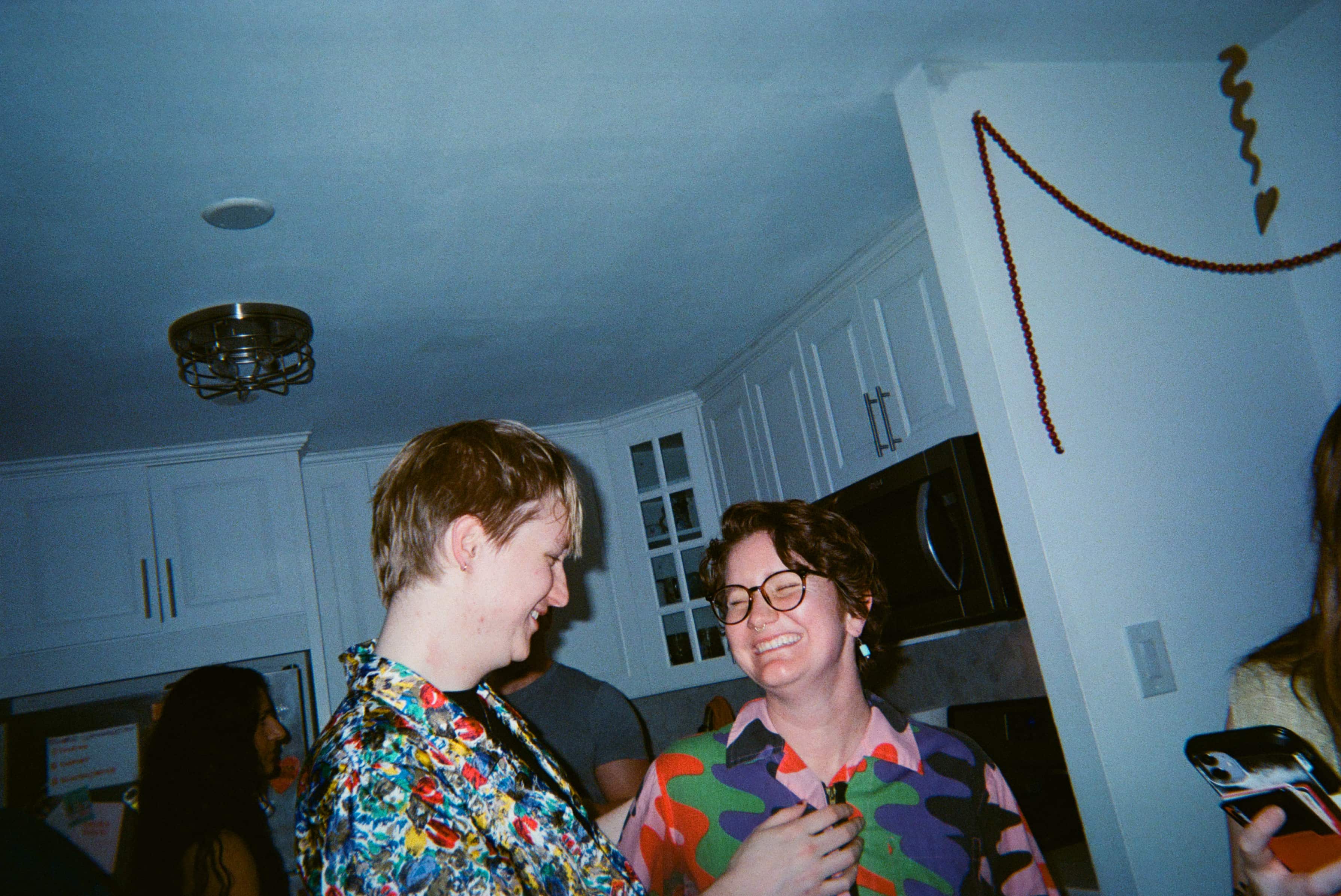 A couple of people in a room.