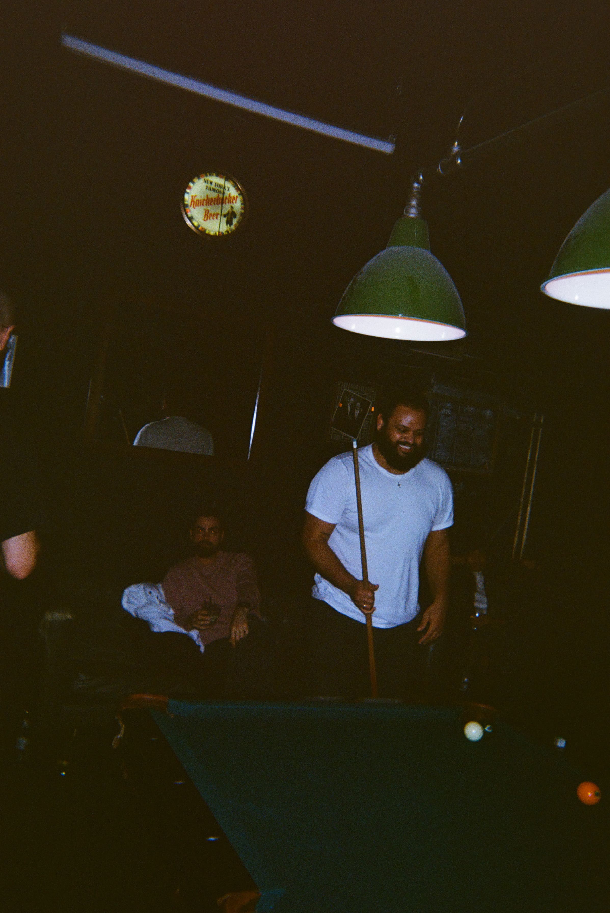 A group of men playing pool.