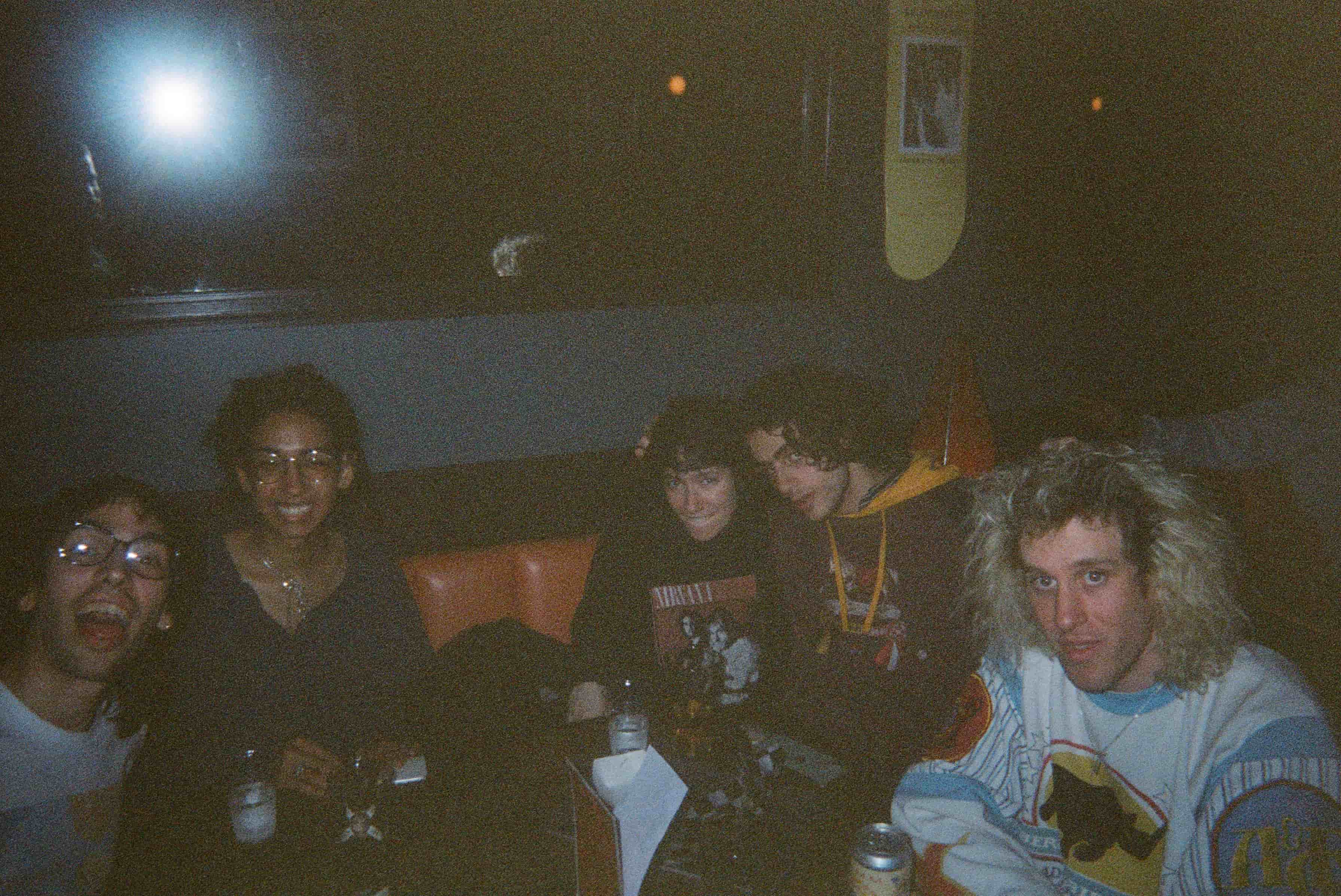 A group of people sitting at a table.