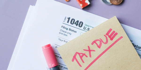 Isn't outsourcing year-end tax adjustments illegal?