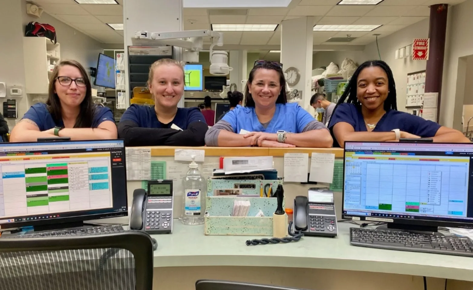 Four staff members facing into the reception area. Four staff members facing into the reception area.