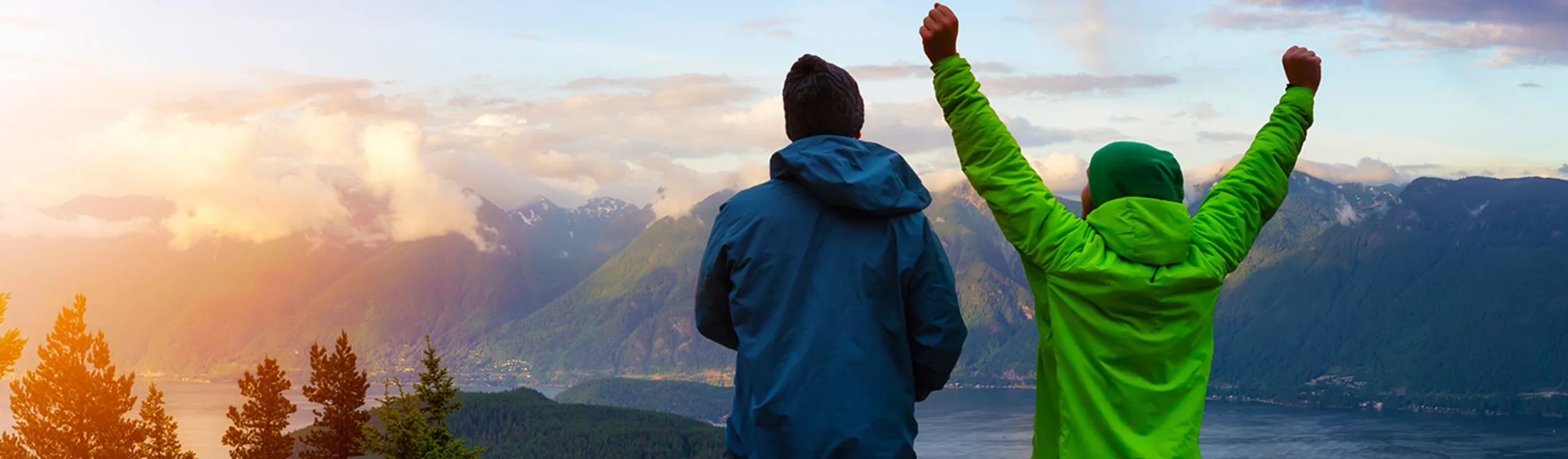 Two people on top of a mountain on Bowen Island, BC. Two people on top of a mountain on Bowen Island, BC.