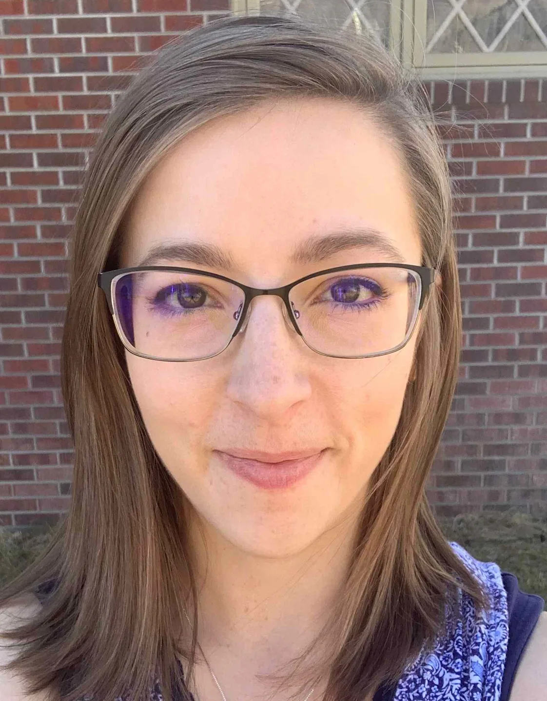 Liz smiling at the camera Liz smiling at the camera