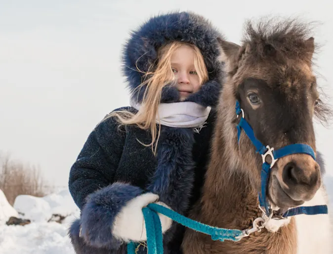 Little Girl with Pony in Snow Winter Little Girl with Pony in Snow Winter