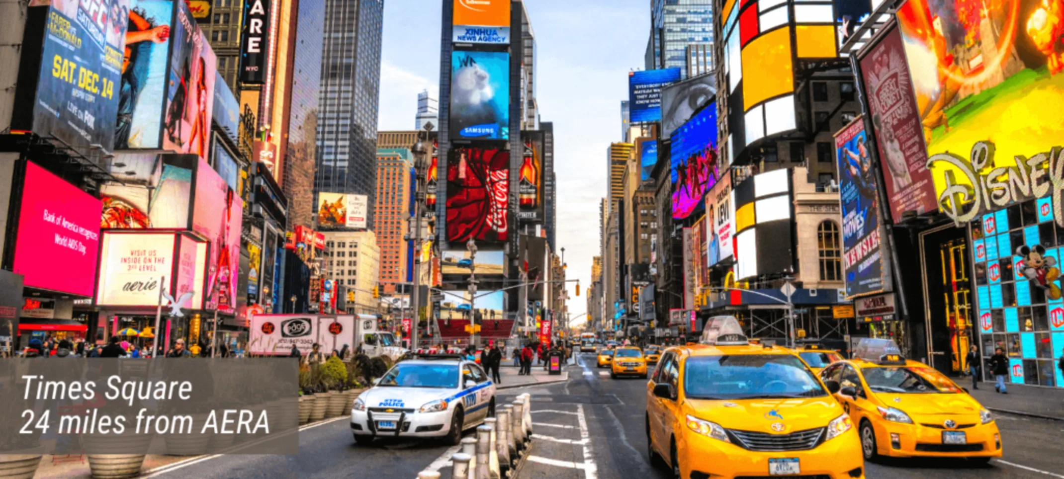 An image of the Times Square with text stating "Times Square 24 miles from AERA". An image of the Times Square with text stating "Times Square 24 miles from AERA".