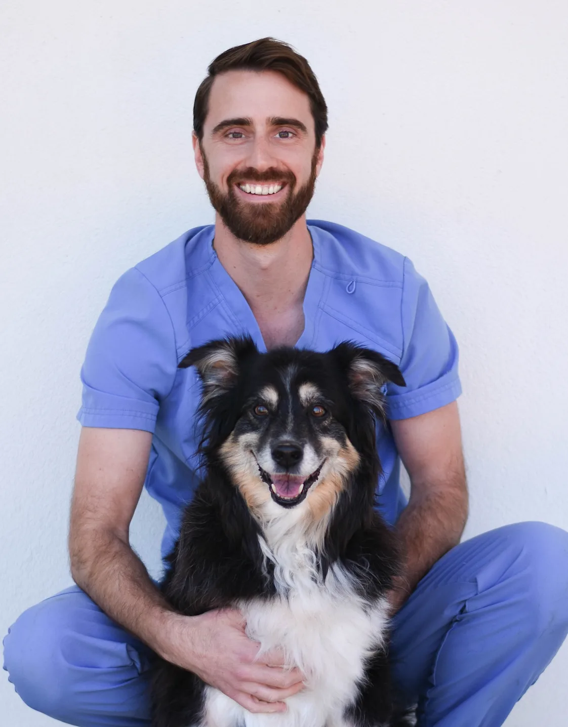 Alex Juneau with a brown/white dog Alex Juneau with a brown/white dog