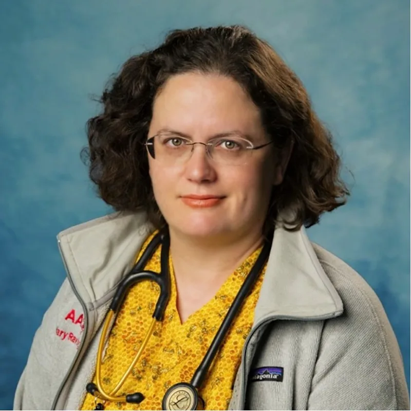 Dr. Mary Rawlings' staff photo from Anne Arundel Veterinary Emergency Clinic where she is holding a white rabbit in her arms. Dr. Mary Rawlings' staff photo from Anne Arundel Veterinary Emergency Clinic where she is holding a white rabbit in her arms.