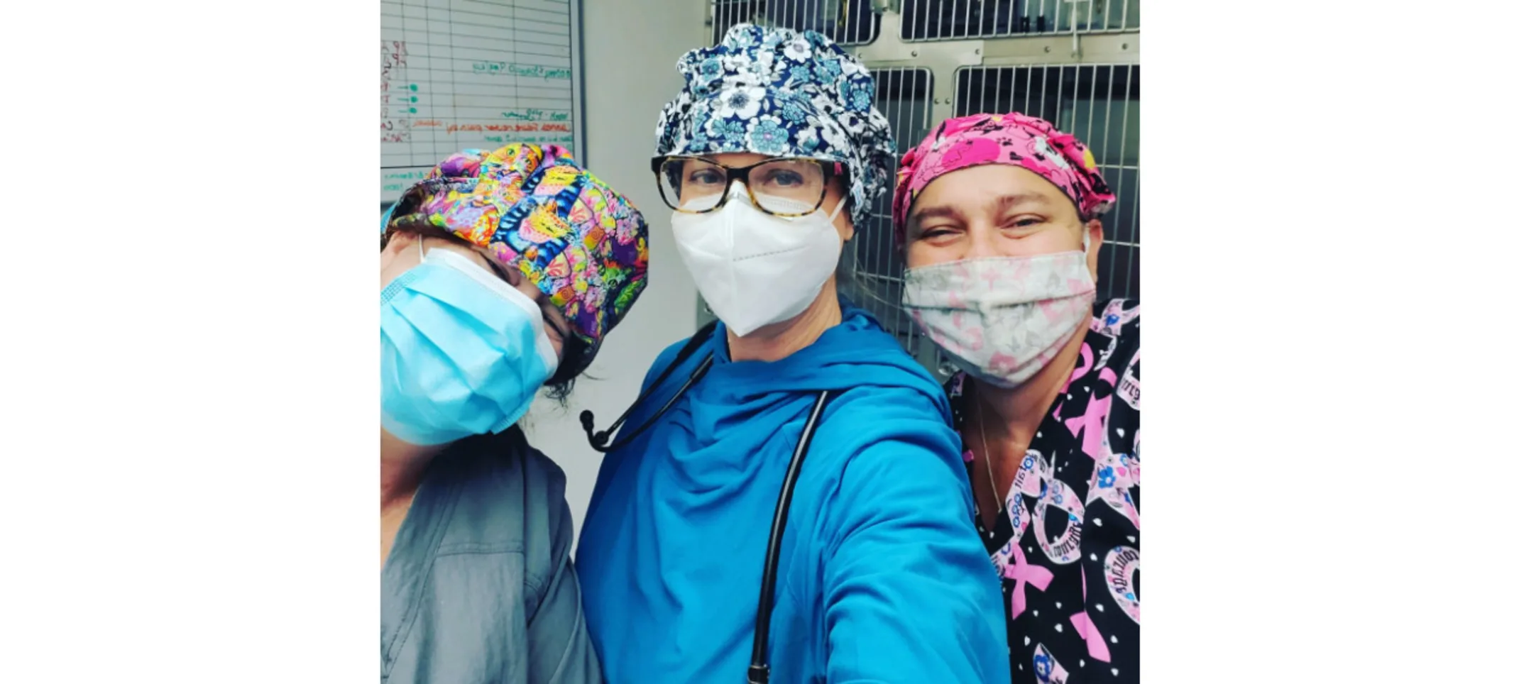 3 staff members in scrubs taking a selfie 3 staff members in scrubs taking a selfie