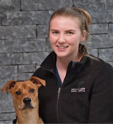 Leah with a small brown dog at Mountainside Animal Hospital Leah with a small brown dog at Mountainside Animal Hospital