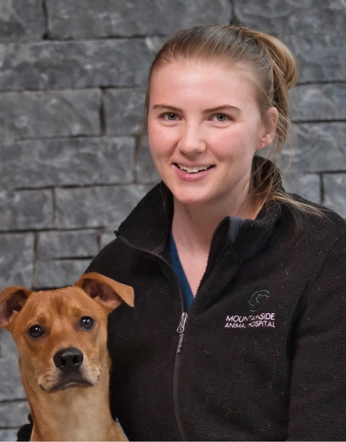 Leah with a small brown dog at Mountainside Animal Hospital Leah with a small brown dog at Mountainside Animal Hospital