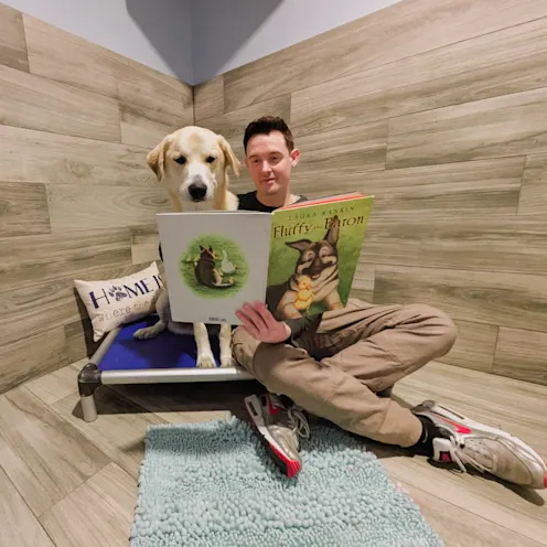 Staff reading to lab in luxury suite. Staff reading to lab in luxury suite.