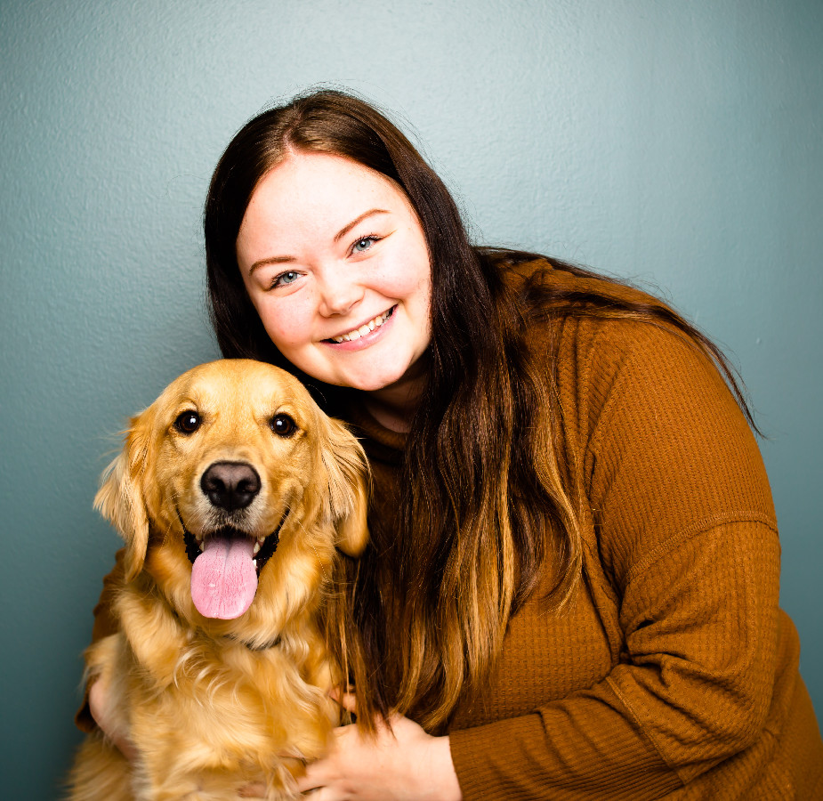 A Kindness Animal Hospital staff member with a dog