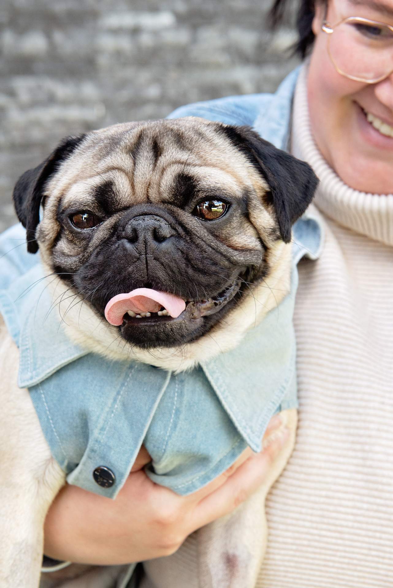 Woman holding a pug