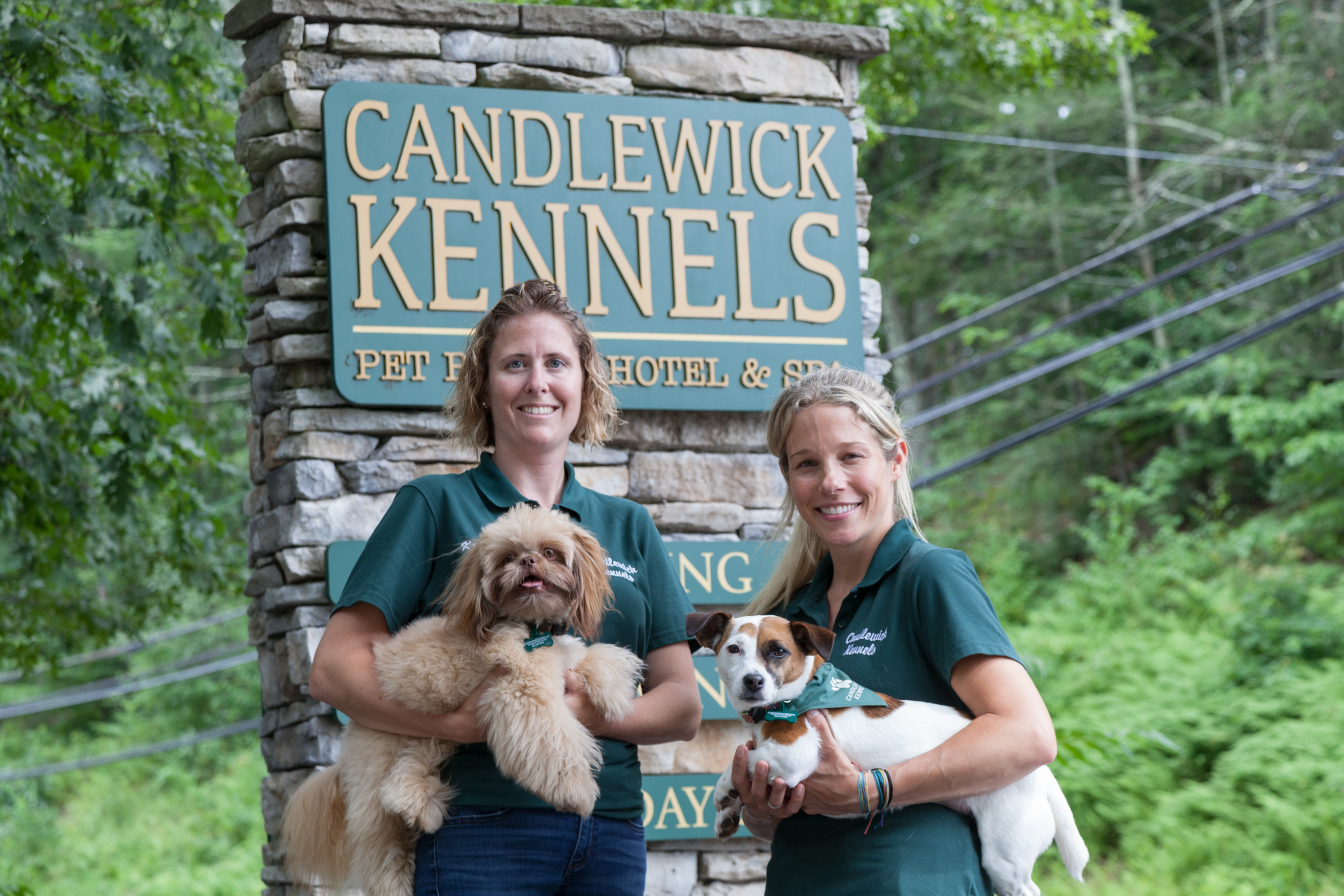 Candlewick Kennels Staff in front of sign