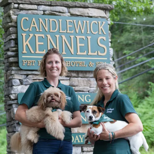 Candlewick Kennels Staff in front of sign