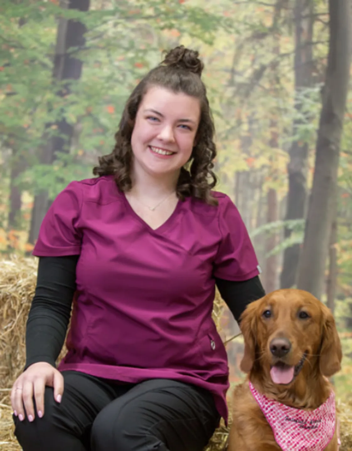 Jessica sitting with a Golden Retriever wearing a pink bandana Jessica sitting with a Golden Retriever wearing a pink bandana