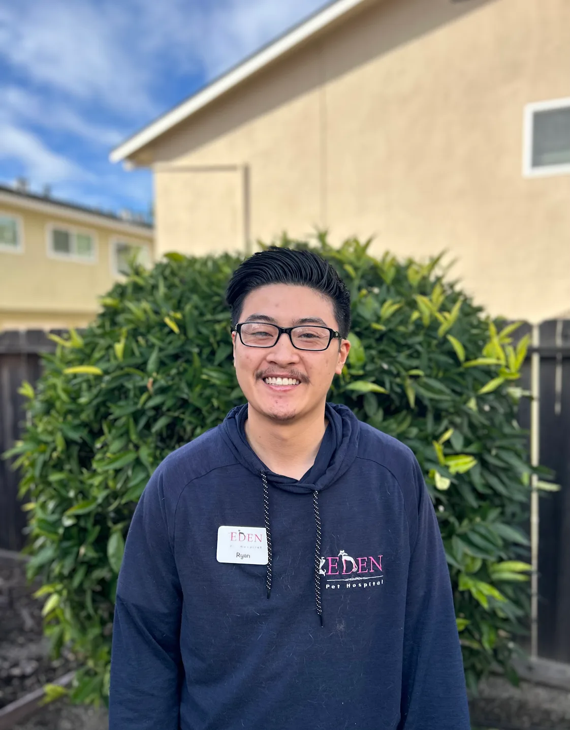 A staff member posing for a photo A staff member posing for a photo