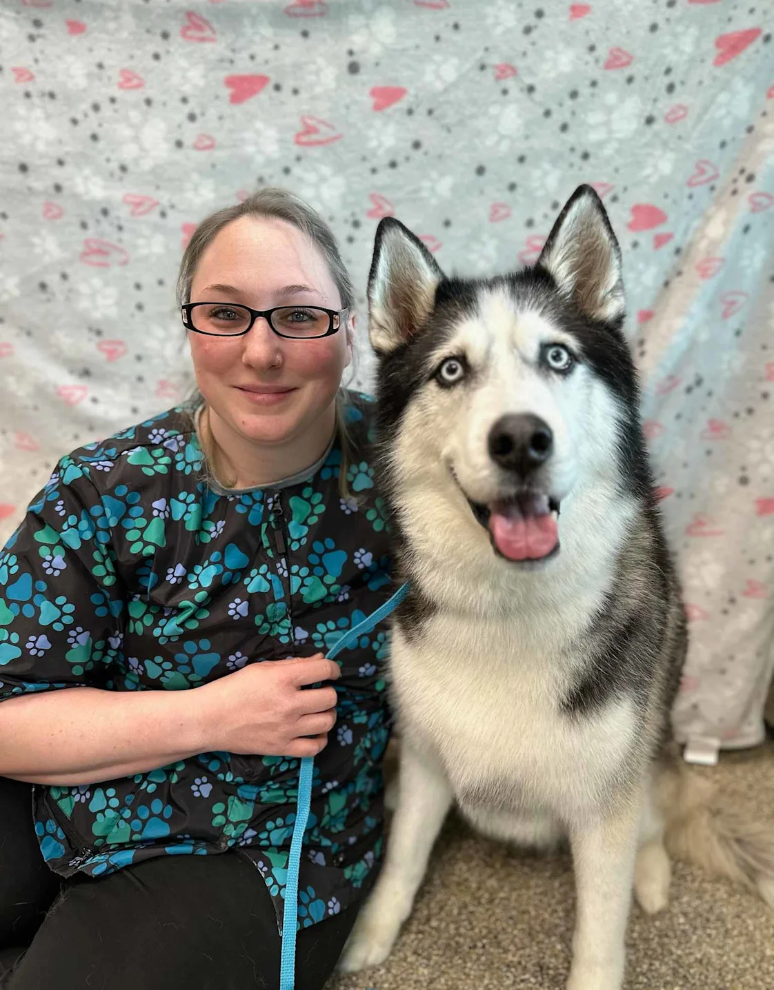 Lindsay, groomer at The Pet Spot, with a husky Lindsay, groomer at The Pet Spot, with a husky