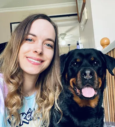 Brittany and a big dog smiling Brittany and a big dog smiling