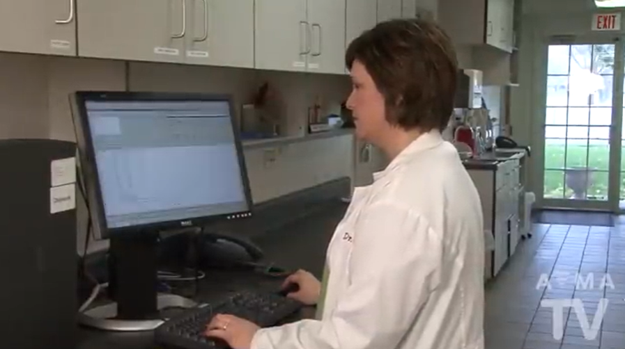 Woman using a computer in a clinic setting