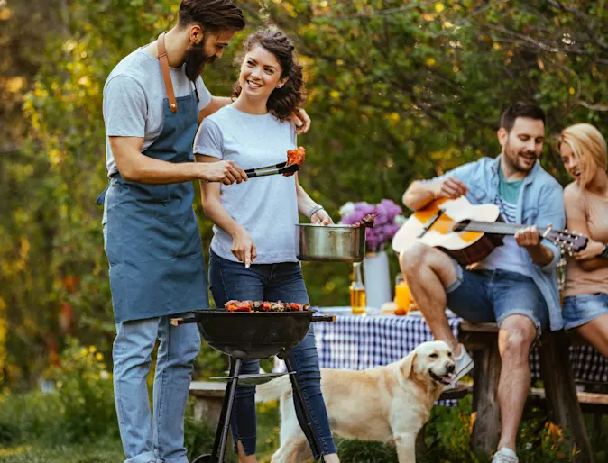 Family Enjoying a BBQ Outdoors Family Enjoying a BBQ Outdoors