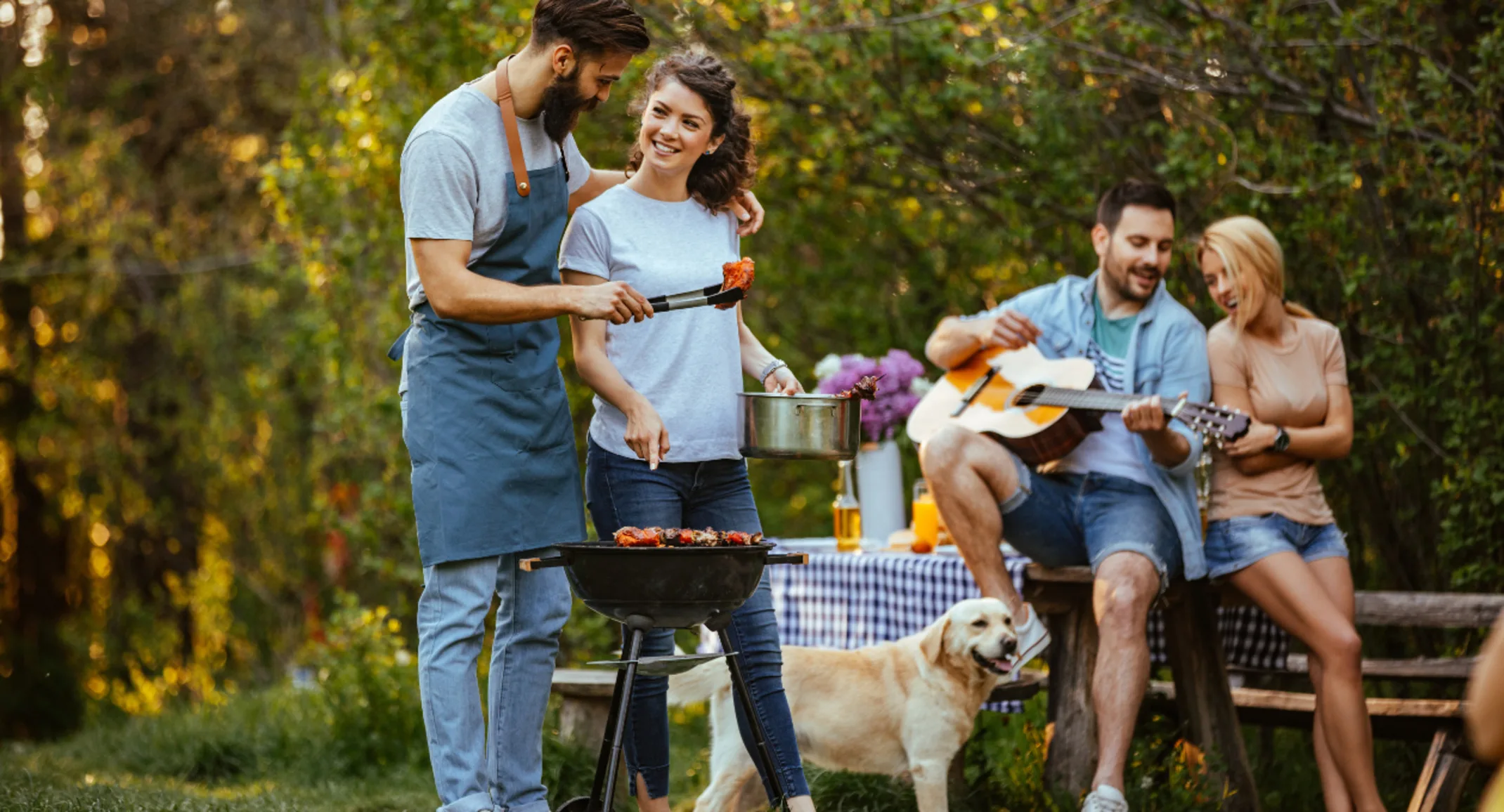 Family Enjoying a BBQ Outdoors Family Enjoying a BBQ Outdoors