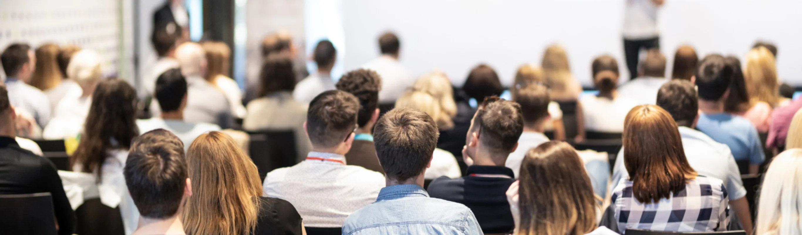 A group of people attending a meeting A group of people attending a meeting
