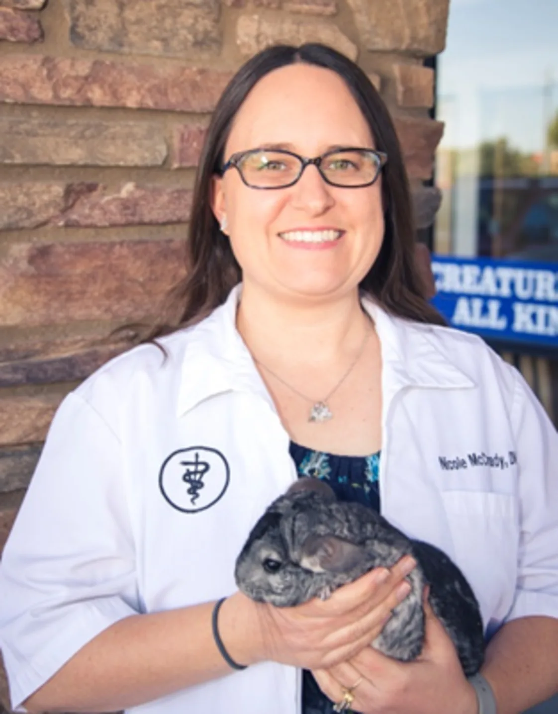 Dr. Nicole McCready holding a chinchilla Dr. Nicole McCready holding a chinchilla