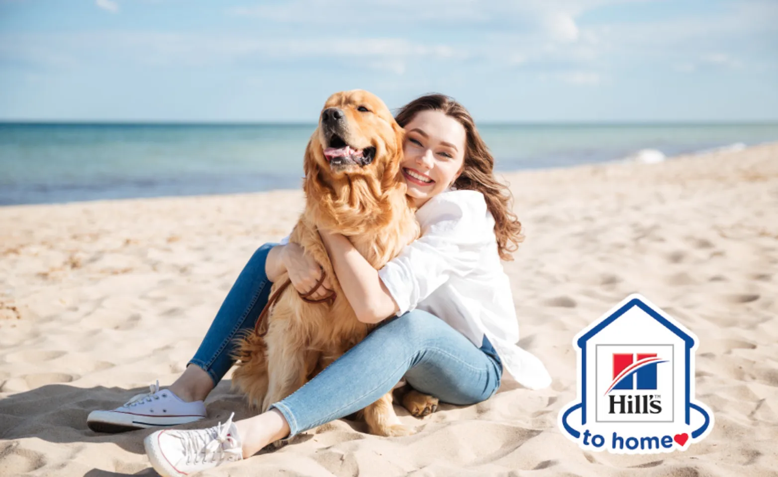 Hills to Home logo woman on beach with dog Hills to Home logo woman on beach with dog