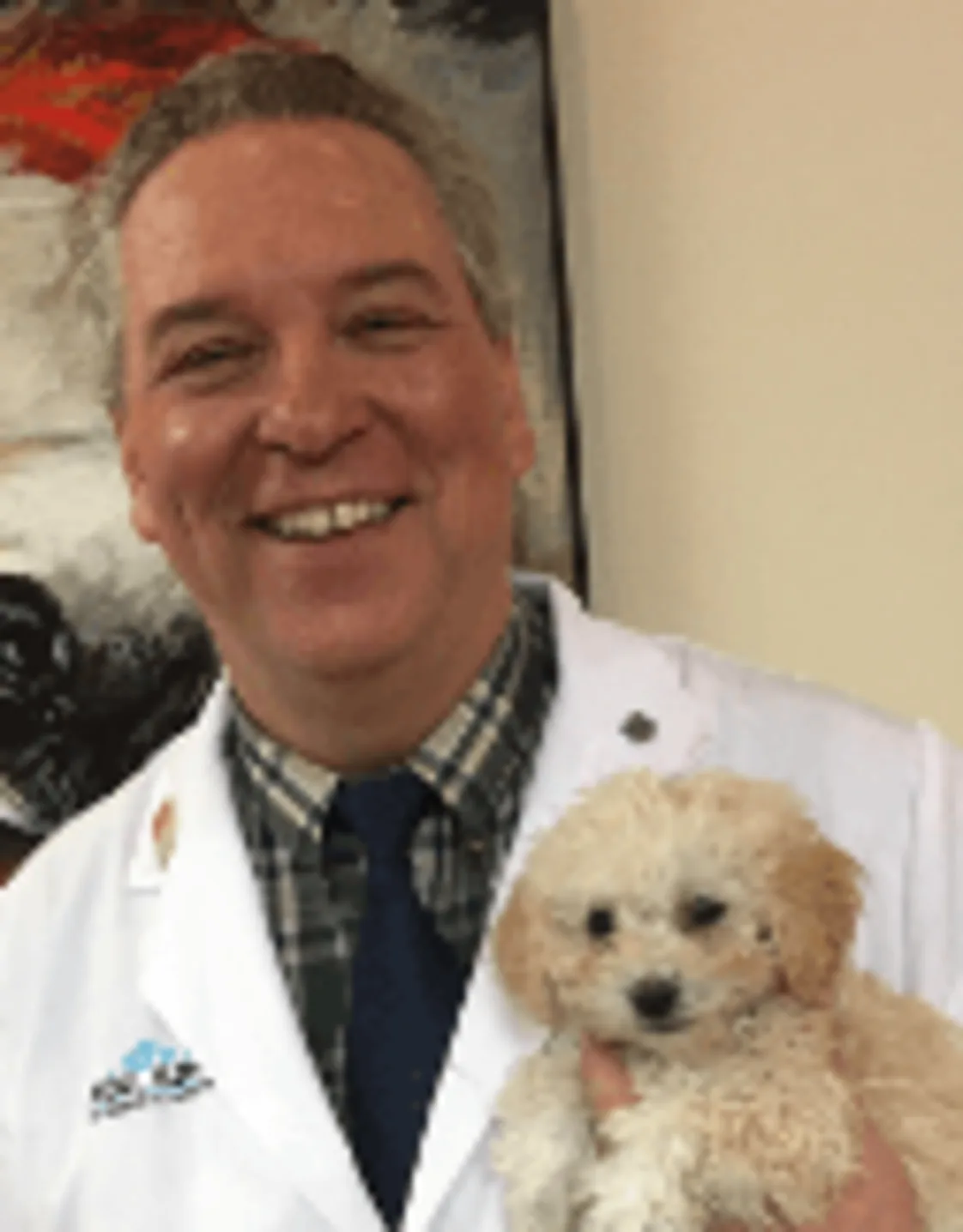 Richard Pratt holding a small dog Richard Pratt holding a small dog