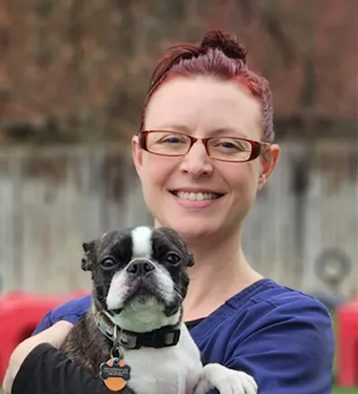Ashley holding a small dog Ashley holding a small dog