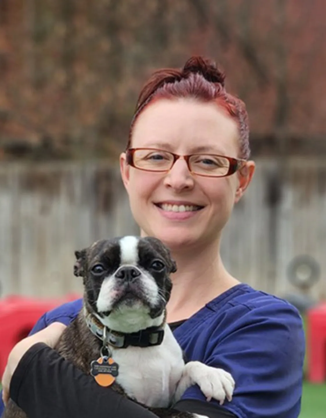 Ashley holding a small dog Ashley holding a small dog