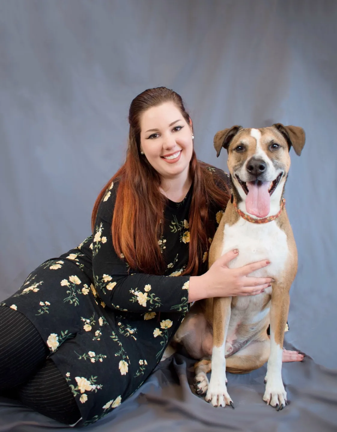 Mel sitting with a dog Mel sitting with a dog