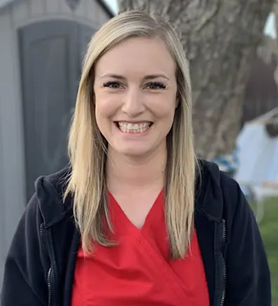 Woman with a red shirt smiling at camera Woman with a red shirt smiling at camera