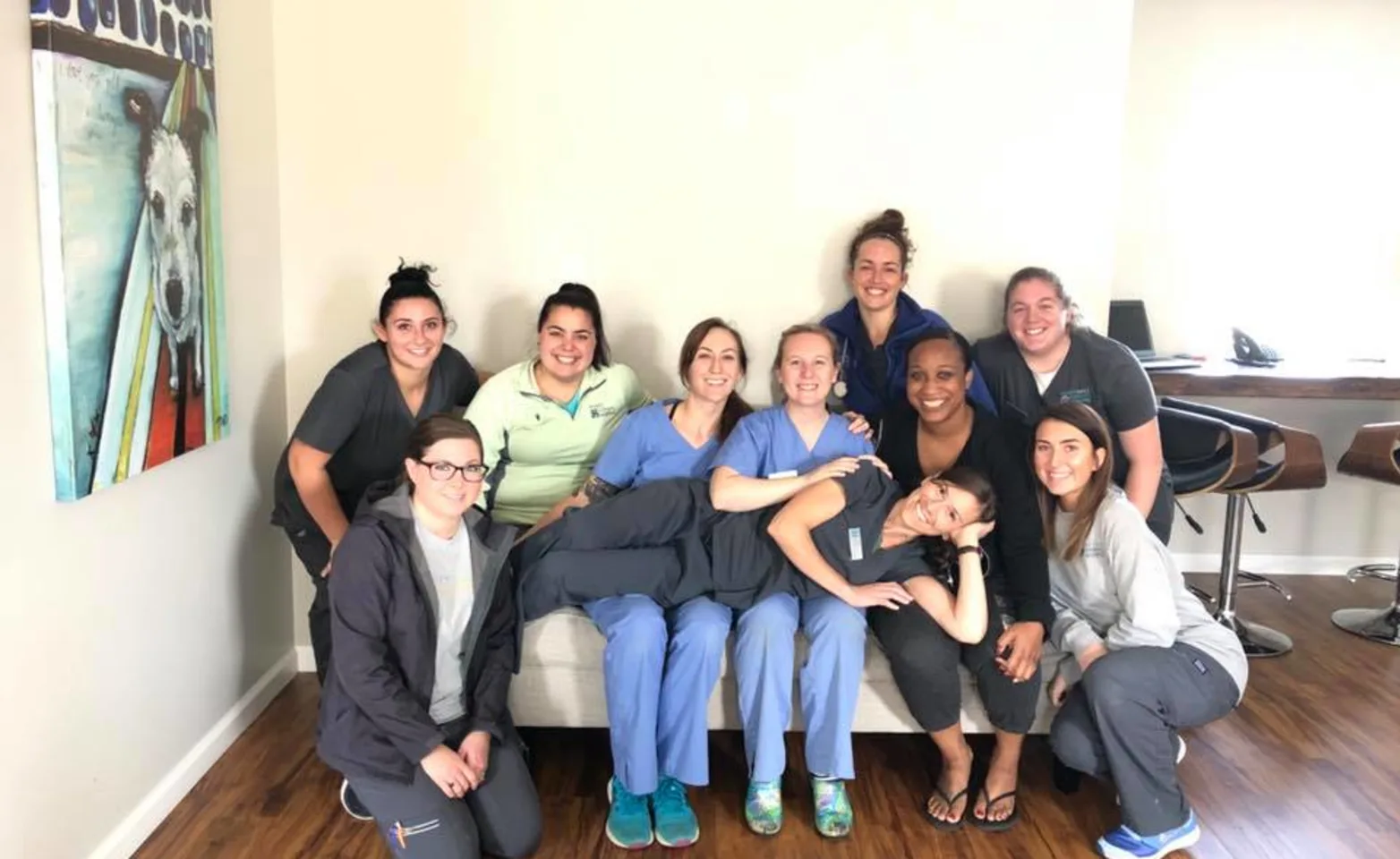 Perry Hall Animal Hospital staff sitting on a couch 